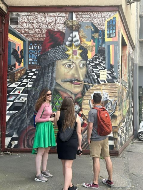 Bucharest Alternative Walking Tour - Cinema Capitol Garden and the restored Square Cat mural