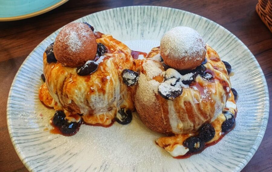 Bucharest: Sweet Delights History and Desserts Walking Tour - Old Town legends, then papanasi to close the loop