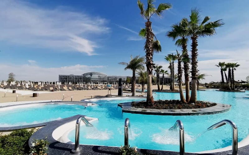 Bucharest: Therme București Entry Ticket with Transportation - The Palm Zone: mineral pools, outdoor jacuzzi, and a calmer adult feel