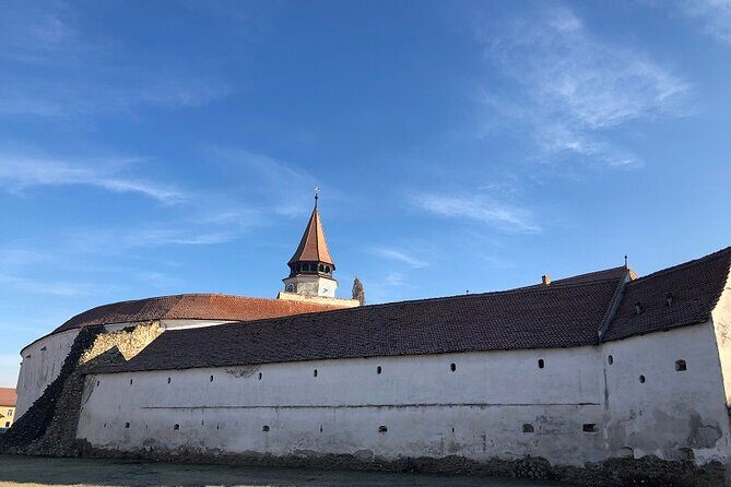 Experience the History of Bran Castle and Saxon Fortifications in Burzenland - Harman Fortified Church: Roman Basilica Roots and 13th-Century Paintings