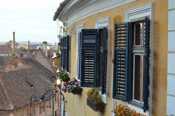 Private Walking Tour of Sibiu - Piata Mica: the square’s architecture and the roofline story