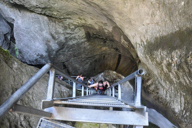 Small-Group Day Trip to the Epic 7 Ladders Canyon from Brasov - Entering the gorge: ladders, bridges, and waterfall power